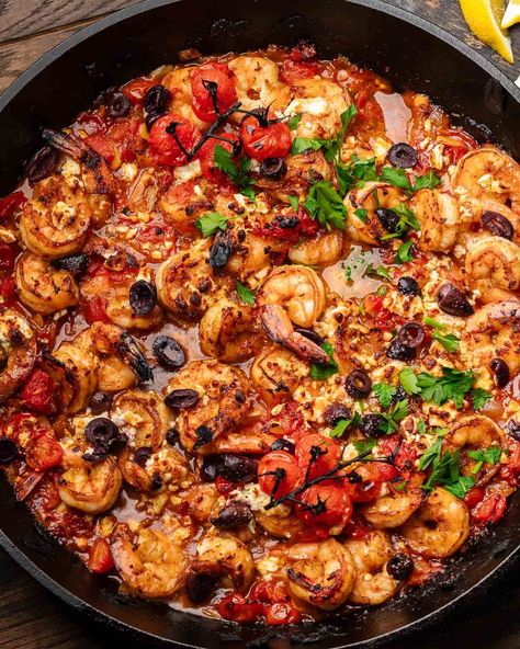 You won't believe how wonderful Shrimp Saganaki is! Succulent shrimp, kalamata olives, melty feta, and tomatoes combine brilliantly in this delicious Greek dish. Serve with warm pita or orzo and enjoy! #greekfood #shrimpsaganaki #shrimprecipes Shrimp Saganaki Recipe, Shrimp Saganaki, Saganaki Recipe, Greek Shrimp, Sip And Feast, Grilled Seafood Recipes, Delicious Seafood Recipes, Prawn Recipes, Shrimp Recipes For Dinner