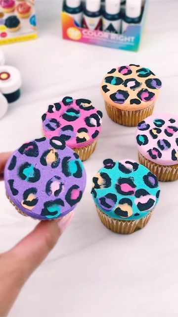 Wilton Cake Decorating on Instagram: "80s and 90s babies: we found the perfect cupcake to go with that trapper keeper. @LisaFrank would be proud. 💖💜🖤💙 Some pro tips: 🖤Use our Color Right Performance Food Coloring Set to get those vibrant colors 💜Freeze the cupcakes for 20-30 minutes after pressing on to wax paper to get that ✨perfect✨ flat top. 🧡 Tips featured: 5 for the colors and 2A for the cupcake frosting #WiltonCakes #Cupcakes #ButtercreamFrosting #CakeCakeCake #CupcakesOfInstagram # Buttercream Designs, Trapper Keeper, Coloring Set, Colorful Cupcakes, Wilton Cake Decorating, Cupcake Icing, Cupcake Flavors, Wilton Cakes, Cupcake Designs