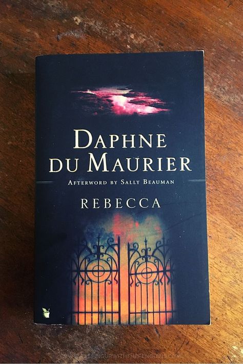 Rebecca is a 1938 Gothic novel by Daphne du Maurier, who described it herself in a letter to her publisher as “a sinister tale about a woman who marries a widower… psychological and rather macabre”. Rebecca Daphne Du Maurier Book Cover, Feminist Fiction, Rebecca Daphne Du Maurier, Letter To Her, Daphne Du Maurier, Gothic Fiction, Scary Books, Gothic Novel, Women Writers