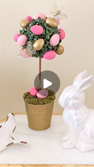 Laura | Tablescapes | Interior Styling on Instagram: "🐇💕🥚DIY Egg Topiary 🥚💕🐇

How cute is this Easter egg topiary?! Super easy and affordable to make! And if eggs aren’t your thing, you can use flowers instead. In fact, head to stories to see a floral version 🥰

Here’s a quick list of the supplies (a lot of which I found at hobby lobby):
🌳 a small pot and paint if necessary
🌳 a styrofoam round or block, cut to size
🌳 moss
🌳 a wood dowel and brown paint
🌳 a boxwood sphere 
🌳 mini foam eggs, painted if you choose (I painted mine)
🌳 butterflies or any other embellishments you like! 

I’ve linked some similar supplies in the LIKEtoKNOW.it app! Link in bio 🥰

🌸 Follow me @thespilledsugar for more spring decor and DIY ideas! 🌸

#easterdecor #eastertopiary #eggtopiary #springdeco Easter Egg Topiary, Egg Topiary, Easter Topiary, Brown Paint, Instagram Diy, Hobby Lobby, Easter Egg, Spring Decor, Easter Eggs