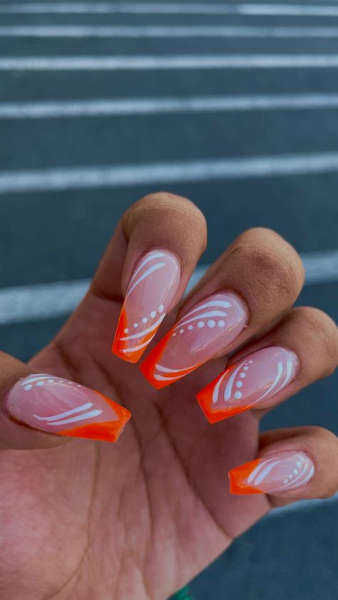 Orange nails, orange nail inspo, bright orange, bright orange nails, white design on nails, orange and white nails, simple nails, clean nails, summer nails, gel x, gel x ideas, simple nail designs, abstract nail design, wavy nail design, natural nail design, manicure minimalist, coffin nail art, nail art, orange coffin nails, cute nail ideas, trendy nails, 2023 nail art Orange Tip Nails Coffin, White Design On Nails, Nails Orange And White, Gel X Ideas, Orange And Silver Nails, Orange And White Nail Designs, Orange Nail Inspiration, Nail Inspo Bright, Wavy Nail Design