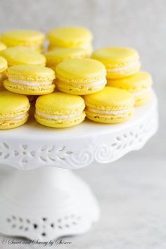 Lemon French Macarons- perfect spring-flavored confections with zesty lemon buttercream that you can make right at home with my new video tutorial!  ~ Sweet and Savory by Shinee Yellow Macaroons, Lemon Macarons, Lemon Buttercream, Kolaci I Torte, Macaroon Recipes, Macaron Recipe, French Macarons, Lemon Desserts, Lemon Recipes