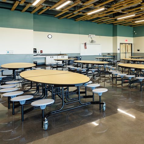 The cafeteria at Grand View Elementary features mobile NPS folding cafeteria tables for a comfortable and communal space for students during their break. They're attractive, durable, functional, and customizable, and a great choice for any busy lunchroom! Explore the full range >>  Pictured: MTR-608MP - NPS Round Cafeteria Table - MDF Core, ProtectEdge, 8 Stools. MET-126 - NPS Oval Cafeteria Table - MDF, ProtectEdge, 12 Stools  Photo Credit: Darren Gouge #SchoolFurniture #SchoolCafeteria Shifting Subliminal, High School Lunches, School Animation, Communal Space, Cafeteria Design, Cafeteria Table, Campus Design, Lunch Table, School Cafeteria