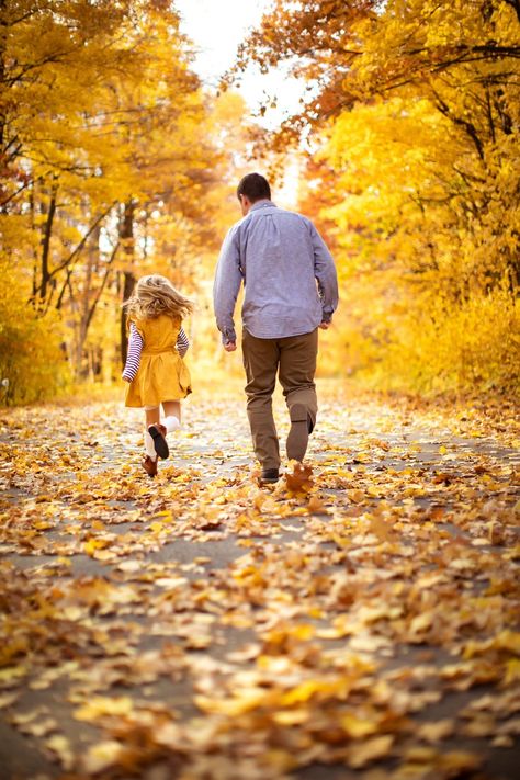 Young girl in bright yellow dress running down a path covered in fall leaves with her dad. Fall Photos Ideas Family, Fall Family Photos Leaves, Fall Forest Family Pictures, Fall Leaves Family Pictures, Kids Fall Photoshoot Ideas, Family Pictures Park, Fall Family Of 3 Photoshoot, Unique Fall Photoshoot Ideas Family, Fall Leaves Family Photos