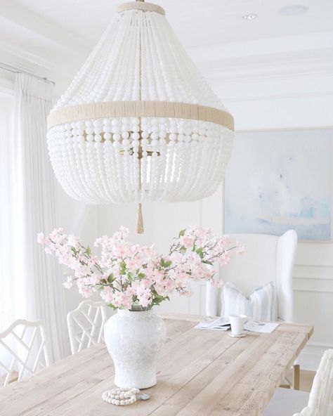 White beaded coastal style chandelier in coastal dining room with white wingback chair and wood dining table via @jseveryday Coastal Style Bedroom, Coastal Chandelier, Coastal Dining Room, Coastal Christmas Decor, Coastal Dining, Coastal Lighting, Coastal Living Rooms, Coastal Bedrooms, Coastal Bedroom