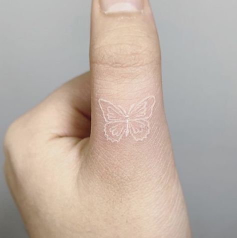 Tattoos Of Names, Hand Tattoos Designs, White Finger Tattoos, White Ink Tattoos Healed, White Butterfly Tattoo, Hand Tattoo Ideas, White Ink Tattoo, Neck Tattoos, Healing Tattoo