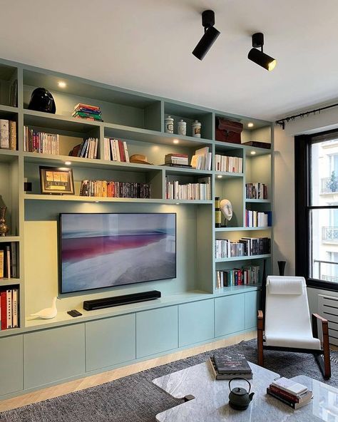 On the other hand, this design has downlights installed on each shelf and contains track lights on the ceiling. Image credit: INSTAGRAM @ADVANESSAFAIVRE Reading Room Design, Bookshelves With Tv, Built In Shelves Living Room, Living Room Wall Units, Living Room Built Ins, Bookshelves In Living Room, Living Room Shelves, Small Home Office, Built In Bookcase