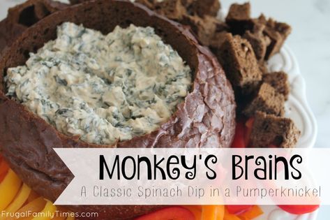 A Classic Party Recipe: Monkey's Brains - or Spinach Dip in a Pumpernickel loaf - which is a way more boring name.  So easy and crowd pleasing!  Great for parties and potlucks. Pumpernickel Bread Spinach Dip, Spinach Dip With Pumpernickel Bread, Spinach Artichoke Dip Pumpernickel, Dip For Pumpernickel Bread, Spinach Dip Pumpernickel Bread, Spinach Pumpernickel Dip, Spinach Dip In Pumpernickel Bread Bowl, Pumpernickel Spinach Dip, Pumpernickel Bread Recipe Dip