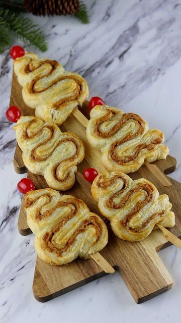 Sheri Wilson on Instagram: "Puff Pastry Christmas Trees 🎄 I’ve seen this cute idea all over and had to give it a try! It really is as simple as it looks! I filled it with biscoff, but you could use your favorite spread. INGREDIENTS: -puff pastry -biscoff spread or filling of choice -egg wash (one egg beaten) Lay out a sheet of puff pastry and spread on a layer of biscoff. Place a second sheet of pastry on top to sandwich the two together. With a knife or pizza wheel, slice the pastry into Puff Pastry Christmas, Sheri Wilson, Pastry Christmas, Christmas Sandwiches, Holiday Charcuterie, Christmas Eats, Pizza Wheel, Biscoff Spread, Eating Vegan