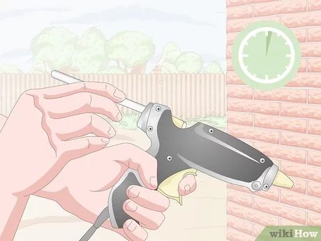 3 Easy Ways to Hang Christmas Lights on Brick - wikiHow How To Hang On Brick Wall, Hang Christmas Lights Outside Hacks, How To Hang Christmas Lights Outside, Brick Clips, Christmas Exterior, Exterior Christmas Lights, Christmas Lights Inside, Outdoor Garland, Christmas Lights Outside