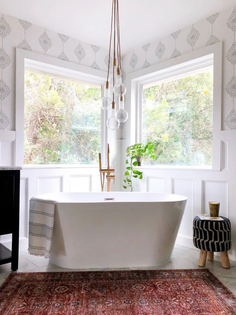 Free standing tub in corner of windows.  Wainscoating  with Serena and Lily wallpaper above. Bubble chandelier over tub. Marble 12 x 24 tile floors. Freestanding Tub In Corner, Chandelier Over Tub, Tub Lighting, Remodeling Trends, Bathroom Chandelier, Stand Alone Tub, Corner Tub, Bathroom Pendant, Bathroom Pendant Lighting