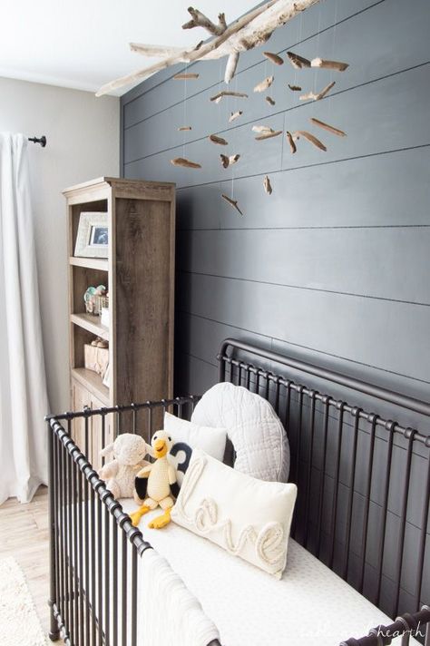 Such a beautiful coastal gender neutral nursery!! www.tableandhearth.com Spindle Crib, Nursery Ideas Boy, Nursery Accents, Nursery Accent Wall, Gray Painted Walls, Grey Baby Nursery, Grey Accent Wall, Dark Grey Walls, Farmhouse Nursery