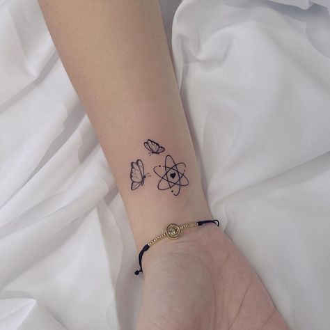 cool 26 Atomic Tattoos for Science Lovers in 2021 Matching Science Tattoos, Cute Science Tattoos, Photosynthesis Tattoo, Biology Inspired Tattoos, Science Themed Tattoos, Women In Stem Tattoo, Nerdy Tattoos Women, Atom Tattoo Small, Scientist Tattoo Ideas