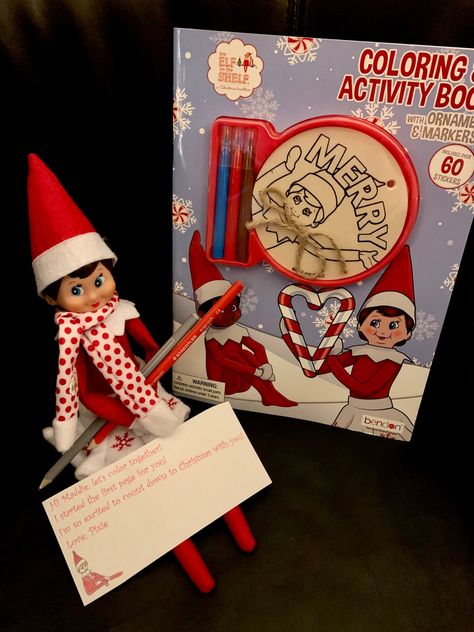 Elf on the shelf with a coloring book and little note #elfontheshelf #elfontheshelfideas Elf On The Shelf Idea, On The Shelf, Elf On The Shelf, Coloring Books, Elf, Shelves, Holiday Decor, Books, Color