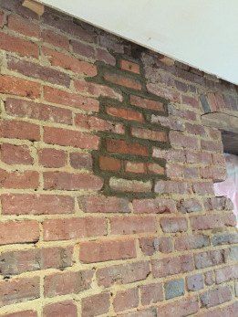 This is the most dramatic wall makeover we have EVER seen! Welcome to the living room of my 100-year-old condo downtown. It doesn't look that old, which is usually quite the compliment, except in this case it means my home was stripped of all character. How To Clean Stone, Faux Brick Backsplash, How To Clean Brick, Wall Stains, Brick Accent Walls, Dramatic Walls, Faux Brick Panels, Interior Brick, Brick Interior Wall