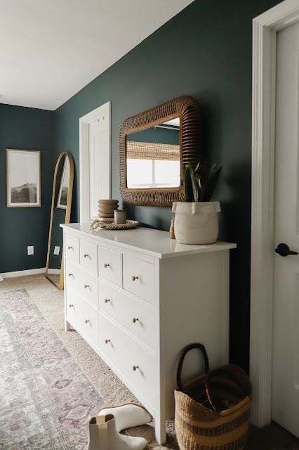 white dresser rattan mirror dark green walls Rock Garden Sherwin Williams, Rocky River Sherwin Williams, Jasper Sherwin Williams, Cascades Sherwin Williams, Sherwin Williams Jasper, Bedroom Maximalist, Plain Room, Vintage Inspired Rugs, Woven Trays