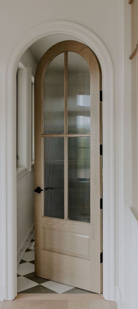 Interior Doors Wood Modern, Single Door Entryway Front Entry, Arched Wooden Doors Interior, Cape Entryway Ideas, Doors That Look Like Windows, Fancy Trim Around Doors, Best Wall And Trim Combo, Arched Mudroom Lockers, Bedroom Balcony Doors