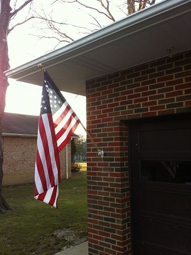 Old glory isn't going anywhere now!  Good info on how to hang a flag on brick.. Flag On House Exterior, Hanging Flag On House, Flag Pole On House, Flag Pole Ideas Diy, American Flag On House, Flag On House, Brick Porch, Eagle Project, Buying First Home