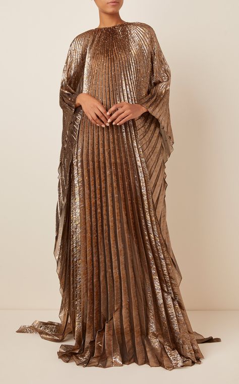 Oscar de la Renta's caftan is simple yet stunning, featuring a high neckline, pleated detailing throughout and a sequined design for a glittered finish. It's a jaw-dropping piece that flows well with gold-tone hoop earrings and strappy sandals. Elegant Maxi Dress, Dress Stores Online, Abayas Fashion, Abaya Fashion, One Piece Dress, Fancy Dresses, Fashion Designers, Elegant Fashion, Couture Fashion