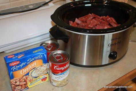 Round steak in the crockpot 1 pound (give or take) round steak  1 can cream of mushroom soup  1 pack dry onion soup mix  1/4 cup water  Sour cream to taste   Slice the round steak into strips.  I like to cut mine while it's still slightly frozen so it slices more easily.  Place into your crock pot.  Top with remaining ingredients and stir well.  Cook on low for 5-6 hours.   Leave the sour cream out of the portion that will be frozen.  I serve it over rice,potatoes or egg noodles. Steak Recipe Crockpot, Round Steak Recipe, Round Steak Recipes, Crockpot Steak, Up Disney, Round Steak, Cooking Bacon, Cream Of Mushroom, Crockpot Beef