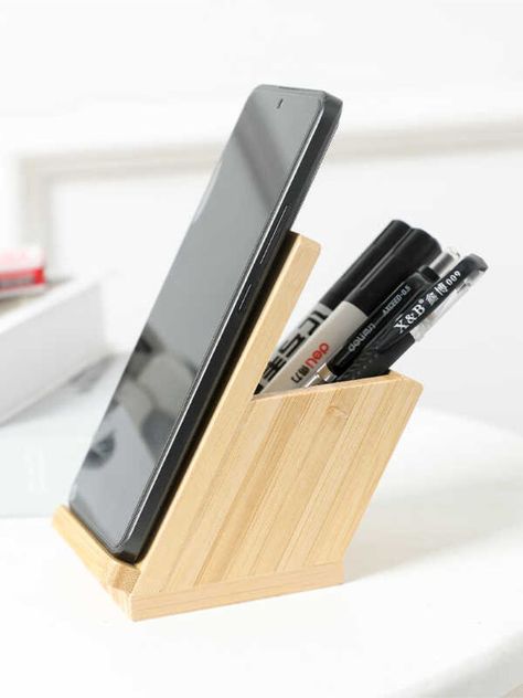 the bamboo angled desk pen holder with phone stand, an eco-friendly and stylish solution for your office organization needs. Crafted from high-quality bamboo, this pen holder features a unique angled design that provides easy access to your pens, pencils, and other office supplies. Additionally, it includes a convenient phone stand, keeping your device within reach while you work. Material:bambooSize:8cm(L)*12cm(H) (1 inch=2.54cm) Angled Desk, Office Accessories Design, Desk Pen Holder, Wood Pen Holder, Wood Phone Stand, Phone Stand For Desk, Bamboo Pen, Unique Desk, Wooden Desk Organizer