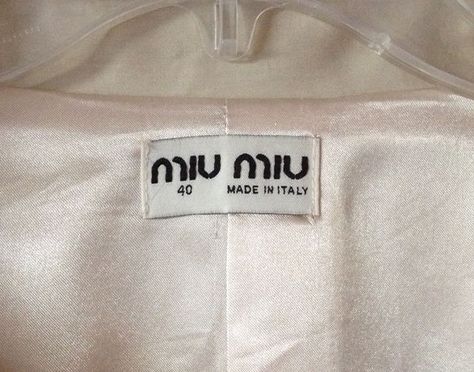 Fake Miu Miu label. Logo stitching is crooked. Label Tag, Clothing Tags, Clothing Labels, Packaging Labels, Label Design, Labels & Tags, Miu Miu, Fashion Brand, Stitching