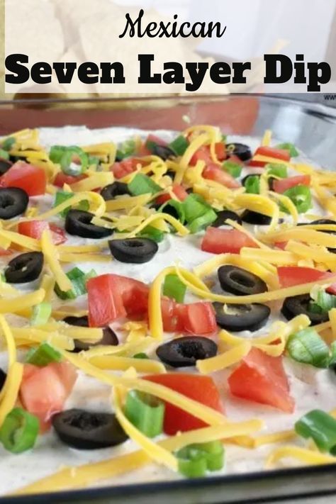 A Mexican Layer Dip consisting of refried beans, guacamole and spiced sour cream topped with colorful toppings. This 7 Layer Taco Dip is served with tortilla chips which makes the best tasting Layered Nacho Dip. #MexicanLayerDip #7LayerTacoDip #LayeredNachoDip #MexicanDip #SevenLayerDip #PartyDip #myturnforus Appetizer For A Crowd, 7 Layer Dip Recipe, Mexican Layer Dip, Seasoned Sour Cream, Pastel Desserts, Layered Dip Recipes, Mexican Dips, Seven Layer Dip, Party Dip