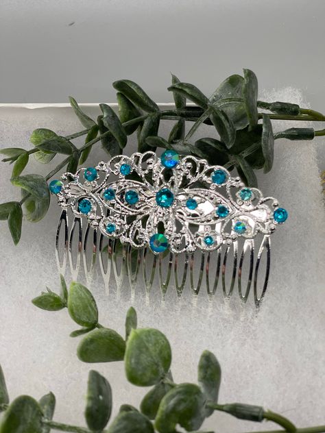 iridescent teal crystal vintage style silver tone side comb hair accessory accessories gift birthday event formal bridesmaid wedding 3.5” antique tone side comb The Hairdazzzel Accessory brings out the beauty and style within. Handcrafted from high-quality beads crystal ,Rhinestone every piece from the hairdazzzel hair Jewelry collection is designed to emphasize and accentuate your individual personality. More than something you’ll wear once and forget, your unique hair Jewelry hair accessories Turquoise Silver Wedding, Dance Hair Piece, Shen Jiu, Teal Accessories, Underwater Wedding, Antique Hair Combs, Headband Accessories, Prom Hair Accessories, Wedding Accesories