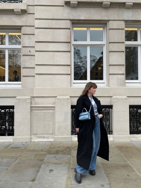 Winter casual outfit featuring long black Weekday coat with Weekday Ace blue jeans paired with Ganni boots. Accessorised with blue highlights like blue mini bag and blue crop top. #winteroutfit #london #blackcoat #inweekday #ganniboots #ganni #blueoutfit Ganni Boots Outfit, Weekday Coat, Ganni Boots, Winter Casual Outfit, Outfit Layering, Black Boots Outfit, Blue Crop Top, Blue Highlights, Blue Crop Tops