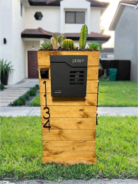 "Welcome to Dream Landscapers! Boost your curb appeal with a beautiful custom mailbox.  This mailbox is made to order and includes the following: Metal Mailbox w/ keys included (12.9 x 4.1 x 14.2 Inch) Wood Base (48h x 23w x 10.5d Inch) --- This is our Largest Mailbox - see other listings for smaller options  Solar lights above the numbers Instruction Manual for Installation (Mailbox is already assembled. You will just need to insert into the ground and secure with the provided screws.) 2 Retrac Retaining Wall Garden, Farmhouse Mailboxes, Antique Mailbox, Black Mailbox, Best Solar Lights, Birdhouse Projects, Custom Mailbox, Large Mailbox, Personalized Mailbox