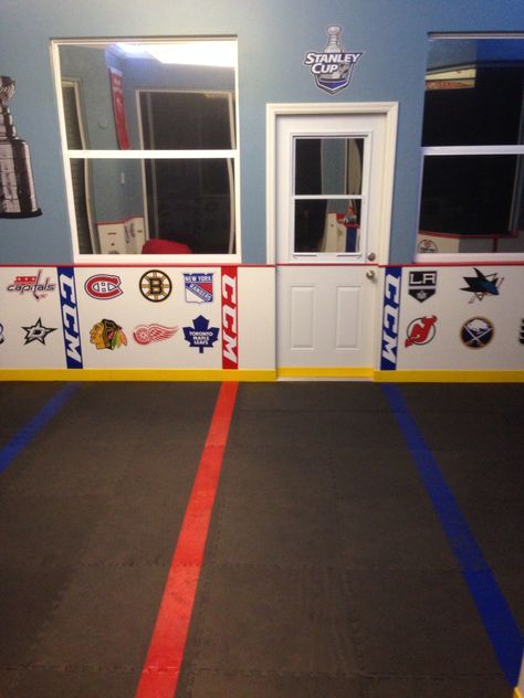 A kids mini sticks (hockey) room in an enclosed patio. Mini Sticks Hockey Room, Ice Hockey Room, Stick Room Decor, Hockey Basement, Hockey Room, Hockey Kids, Rooms Decor, Enclosed Patio, Boys Rooms