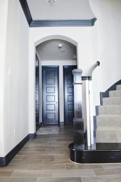 How to Transform Your Home with Black Trim And Black Doors | We're the Joneses Home With Black Trim, Farmhouse Door Trim, Black Baseboards, Black Trim Interior, Painting Interior Doors Black, White Interior Doors, Trim Paint Color, Bungalow Interiors, Bungalow Interior