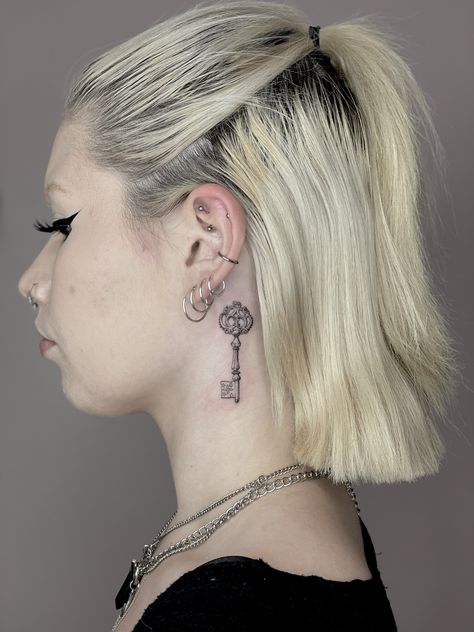 Small neck tattoo of an old key, check out the picture of the Healed one on IG: @veintidos.studio Key Tattoo Behind Ear, Ancient Key Tattoo, The Black Keys Tattoo, Key Tattoo Placement, Old Key Tattoo, Nape Of Neck Tattoo, Small Neck Tattoo, Frilled Neck Lizard Tattoo, Microrealism Tattoo