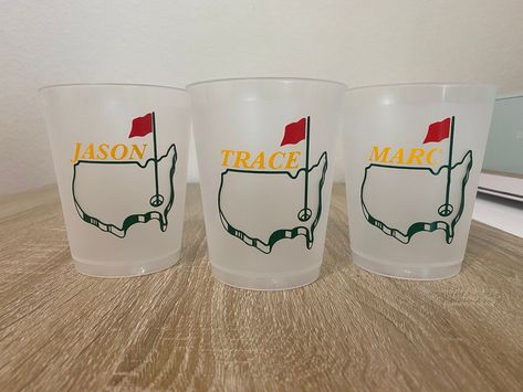 Masters Weekend Drink Cups, Bachelor Party Decor, Golf Party Favors  These cups make the perfect addition to any golf themed party or weekend! Personalized them with a name or anything you want!  Cup Details: - Plastic Reusable Cups - Dishwasher Safe (for longest lasting vinyl, hand wash is recommended.) - Holds 16 fl oz  - Red, Green, and Yellow vinyl as shown in the pictures  Check out our other golf party decor and favors! Golf Cups, Plastic Cups Design, Golf Themed Party, Bachelor Party Decor, Golf Party Favors, Bachelor Party Favors, Plastic Party Cups, Masters Golf, Golf Party