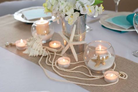 Beach Bliss | CatchMyParty.com Napkins Ideas, Beach Wedding Candles, Beach Table Decorations, Beach Centerpieces, Candles And Flowers, Starfish Wedding, Beach Wedding Centerpieces, Beach Wedding Reception, Beach Bridal Showers