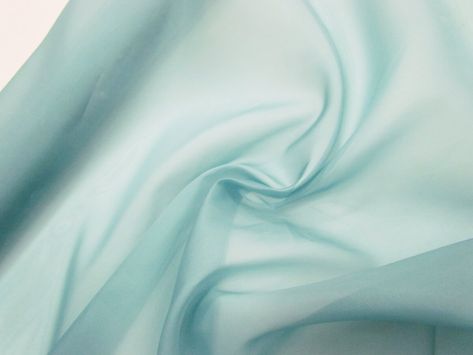 This soft blue green organza is a very light weight fabric made from 100% silk with a good amount of structure and stiffness. This organza is a fabric with a slight lustre and a very soft feel that holds its shape well while still having a very soft sheer look to it. As this organza is sheer, a lining may be desired or some applications Blue Green Fabric, Blue Organza, Organza Fabric, Fabric Structure, Silk Organza, Fabric Trim, Fabric Online, World Class, Silk Printing