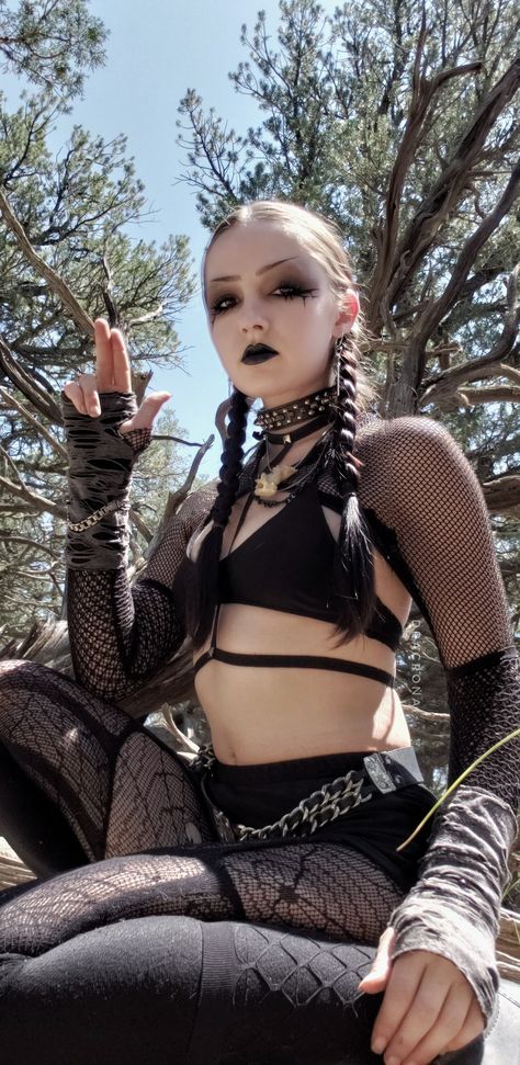 Goth • gothic • rave • festival • summer • bone • choker • studs • spikes • fishnets • spiderweb • belt • silver • chain • braids • black hair • long hair • pale • outfit • ensemble • girl • gloves • thrifted • heavy eyeliner • dark makeup • black lipstick Small Eyebrows Alt, Small Eyebrows, Elf Belt, Nyx Eyeshadow, Summer Goth, Bracelet And Necklace, Grunge Goth, Goth Grunge, Alternative Outfits