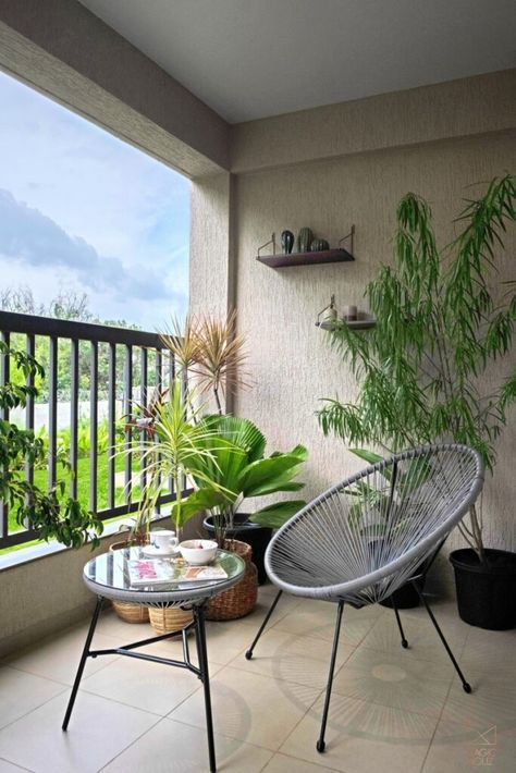 Aesthetically Soothing Apartment Interiors Invoking serenity | Magic Houz - The Architects Diary Balcony Decor Ideas Small, Grey Striped Walls, Balcony Tiles, Green Headboard, Balcony Decor Ideas, Cosy Interior, Balcony Railing Design, The Architects Diary, Geometric Vases