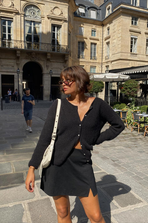 @gabriellealysrojas is wearing the Gaspard cardigan in black with a black mini skirt and white handbag. We love seeing you style your favorite Sézane items! Shop this knit online now! Mini Cardigan Outfit, Sezane Gaspard, Gaspard Cardigan, Mini Cardigan, Cardigan Outfit, White Handbag, Cardigan Outfits, Black Mini Skirt, Chunky Sweater