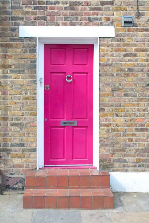 Bold Front Door Colors, Bold Front Door, Bright Front Doors, Black Railing, Front Door Ideas, Exterior Door Colors, Tan House, Pink Front Door, Unique Front Doors