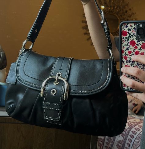 this is the black soho coach shoulder bag it has a buckle in the front and the sides. Black Satchel Bag Aesthetic, Black Purse Vintage, Black Y2k Purse, Cute Shoulder Bag Aesthetic, Coach Soho Shoulder Bag, 90s Designer Bags, Buckle Shoulder Bag, Vintage Black Coach Bag, Vintage Coach Soho Bag