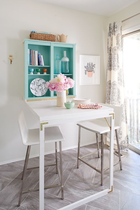 Save Space with This Adorable Fold-Down Table That Doubles as a Desk Stylish Small Kitchen, Small Apartment Hacks, Murphy Table, Small Apartment Storage, Fold Down Table, Apartment Hacks, Drop Down Table, Apartment Storage, Small Kitchen Tables