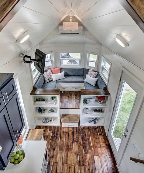 The built-in benches have storage underneath, plus they fold out into a bed that sleeps two. Tiny House Storage, Tiny House Inspiration, Tiny Spaces, Tiny House Interior, Built In Bench, Tiny House Living, Tiny House Plans, House Goals, Tiny House Design