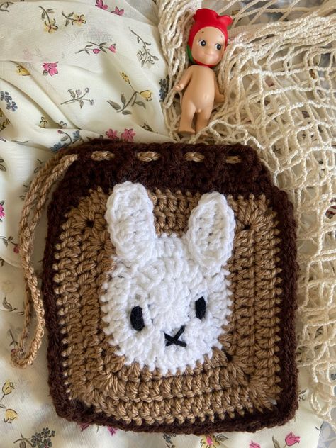 miffy (bunny) crochet pouch rose sonny angel on the side and floral background Miffy Granny Square Pattern, Miffy Granny Square, Miffy Crochet Granny Square, Bunny Granny Square, Crochet Granny Square Pouch, Miffy Tapestry Crochet, Crochet Miffy Plushie, Miffy Plush Crochet, Miffy Pouch Crochet