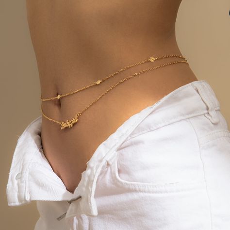 Give your waistline some attention with this shining gold-plated waist chain. Includes two silver-plated waist chains Full graphic text: Babygirl. Chain one: 28.7'' L with 9.8'' extender Chain two: 29.5'' L with 9.8'' extender Letters: 1.3'' L Lobster claw clasp Gold-plated copper Bracket Bra Chain, Cheap Adjustable Chain Jewelry, Cheap Trendy Chain Body Jewelry, Cheap Gold Body Jewelry, Trendy Cheap Waist Chain With Chain Strap, Affordable Minimalist Gold Body Jewelry, Cheap Gold Jewelry With Adjustable Chain, Luxury Gold Body Chain, Trendy Cheap Waist Chain