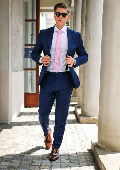 23 Best Pink Outfit Ideas for Men with Styling Tips Light Blue Suit With Pink Shirt Men, Blue Pink Suit Men, Navy Blue And Pink Suit Men, Blue Suit With Pink Shirt Men, Light Pink Shirt Outfit Men Formal, Pink Tie Outfit Men, Blue Suit Pink Shirt, Navy Suit Pink Shirt, Light Pink Shirt Outfit