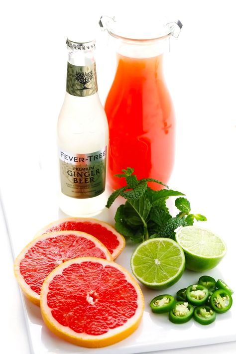 This Spicy Grapefruit Ginger Fizz mocktail is made with grapefruit juice, spicy ginger beer, fresh lime juice, mint, and jalapeño. It's easy to whip up in 5 minutes, minimally sweet, and so flavorful! | gimmesomeoven.com #mocktail #drink #gingerbeer #alcoholfree #grapefruit #spritzer Fizz Mocktail, Mocktail Drink, Ginger Fizz, Drink Recipes Nonalcoholic, Gimme Some Oven, Alcoholic Cocktails, Healthy Menu, Fancy Drinks, Mocktail Recipe