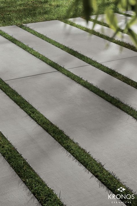 Outdoor design ideas: Dry installation with concrete look porcelain pavers. Collection by Kronos Ceramiche: Ske 2.0 Prima Materia Cemento (R11C) #kronostiles #kronosceramiche #madeinitaly #porcelaintiles #porcelainstoneware #gresporcellanato #grescerame #feinsteinzeug #porcelainpavers #luxurytiles #patiotiles #gardenareatiles #gardendesign #drylaying #outdoortiles #R11tiles #nonslipfloor #concretetiles #concretelook #greseffettocemento #betonoptik #architect Large Concrete Pavers, Grass Driveway, Car Porch, Pavement Design, Porcelain Pavers, Paving Ideas, Paver Designs, Outdoor Paving, Paving Design