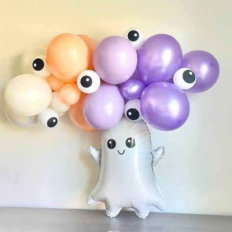 We loves these DIY latex balloon garlands for Halloween! We paired cute googly eye ball latex balloons with a pastel set of cream, cheeky orange, blossom and pearl lavender colors for a sweet Halloween party decoration Size:6 Feet Wide Includes: 6- 5" eyeball latex balloons 50- 5" and 11" latex balloons in mix of: Cream Cheeky Orange Blossom purple Pearl Lavender Glue Dots and Supplies to create this design 6' Balloon garland decorator strip Instructions to Assemble Optional: 26" Glam Ghost Foil Pastel Halloween Decorations Diy, Pastel Halloween Color Palette, Halloween Balloon Garland, Halloween Color Palette, Halloween Balloon, Halloween Party Decoration, Eye Ball, Orange Party, Pastel Halloween