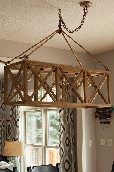 I have seen a few tutorials floating around for this DIY Hanging X Wooden Chandelier but they all seemed so complicated with fancy cuts and tricky wiring.  I made my own and actually used a prefab cheapo 6 light builder basic bathroom light bar to wire it.  It was so much easier than wiring each individual {...Read More...} Diy Dining Room Light Fixtures, Bathroom Light Bar, Chandelier Diy, Kitchen Lighting Design, Wood Light Fixture, Diy Light Fixtures, Vintage Industrial Lighting, Diy Dining Room, Diy Light